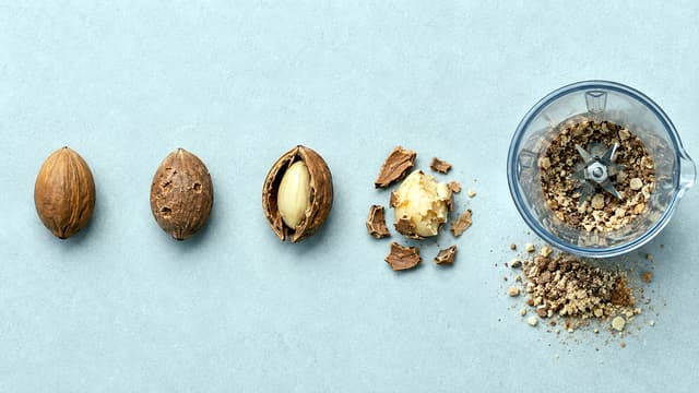 Five-stage comparison shows an intact cherry pit, tooth marks, a cracked shell, a chewed kernel and blended material for exposure triage and safety.